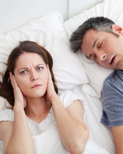 woman complaining about husband snoring | Sleep Apnea Treatment | Gilbert AZ